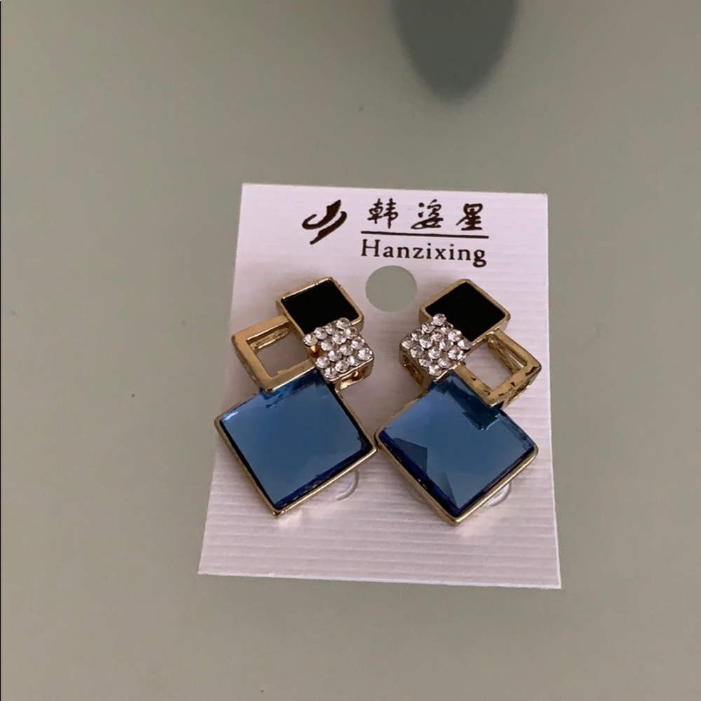 A pair of statement stud earrings